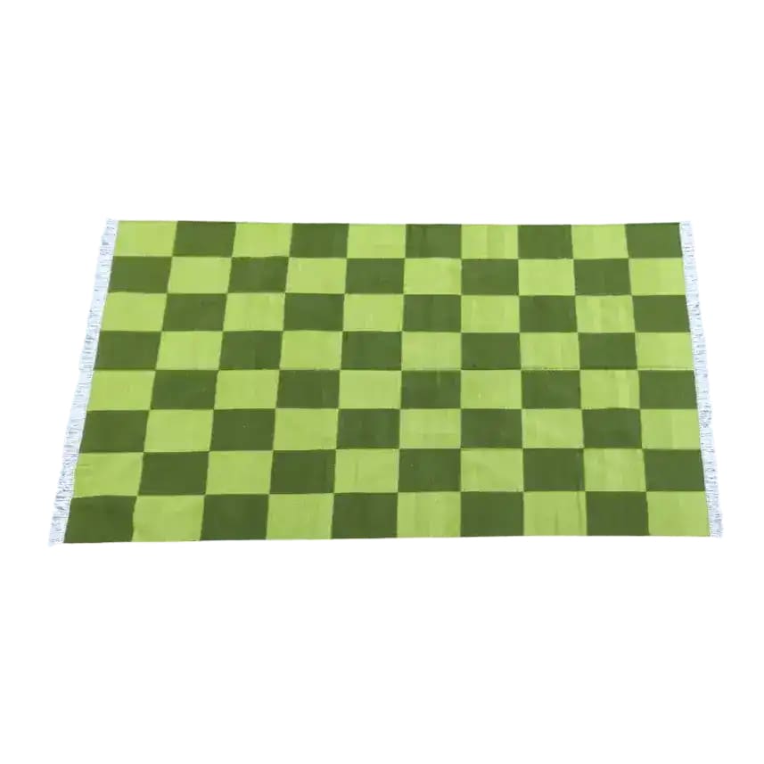 This image showcases a handwoven green checker cotton area rug, perfect for adding a boho touch to your living room or bedroom. The vibrant green squares create a lively pattern, ideal for living room area rugs or as rugs for bedroom spaces.