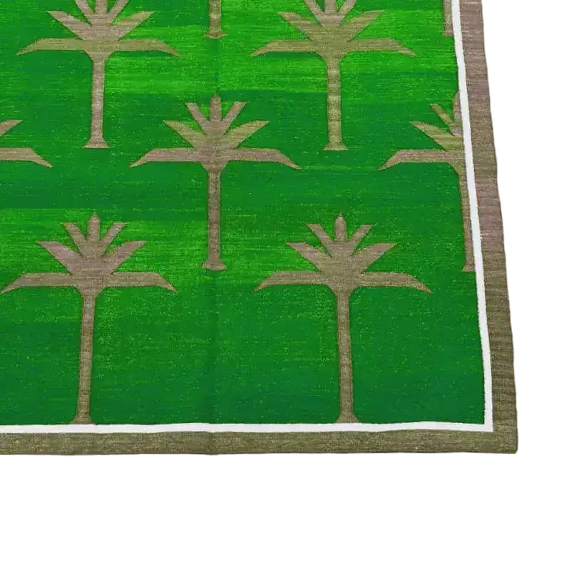 Handwoven green cotton area rug featuring a pattern of palm trees, perfect for adding a boho touch to your dining room or living room. This 8x10 rug is ideal for placing under a dining table or as a stylish centerpiece in your living space.