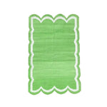 Handwoven green and white scallop cotton area rug, perfect for adding a touch of boho style to your living room. This large area rug features a vibrant green with a unique scalloped edge, ideal for those seeking stylish rugs for living room spaces.