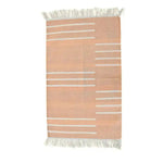 Handwoven light peach and white minimalistic cotton area rug with fringes, perfect for adding a boho touch to your living room. This elegant rug features subtle horizontal stripes and is ideal for those seeking area rugs for living room decor.