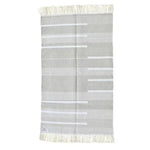 Handwoven minimalistic gray cotton area rug with fringes, perfect for large living rooms. This boho rug features a subtle pattern, ideal for living room rugs 8x10.