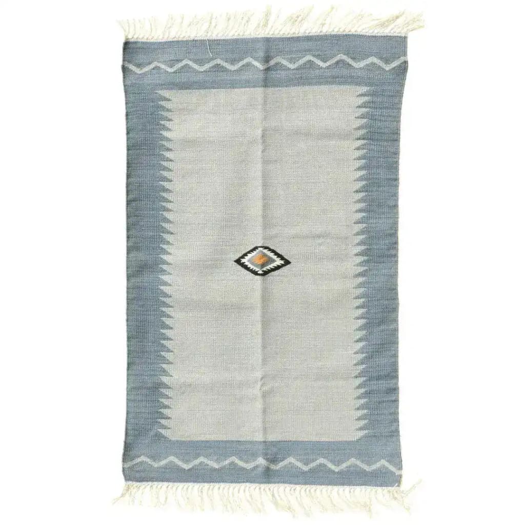 Handwoven minimalistic vintage gray cotton area rug with fringes, ideal for bedroom decor. This large boho rug features a subtle zigzag pattern and a central geometric design, perfect for adding a touch of elegance to any bedroom.