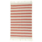 Handwoven orange and white striped cotton area rug with fringes, perfect for adding a boho touch to your dining room or living room. This stylish cotton rug brings warmth and texture to any living room area.