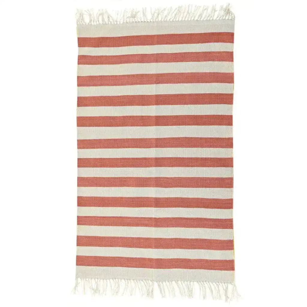 Handwoven orange and white striped cotton area rug with fringes, perfect for adding a boho touch to your dining room or living room. This stylish cotton rug brings warmth and texture to any living room area.