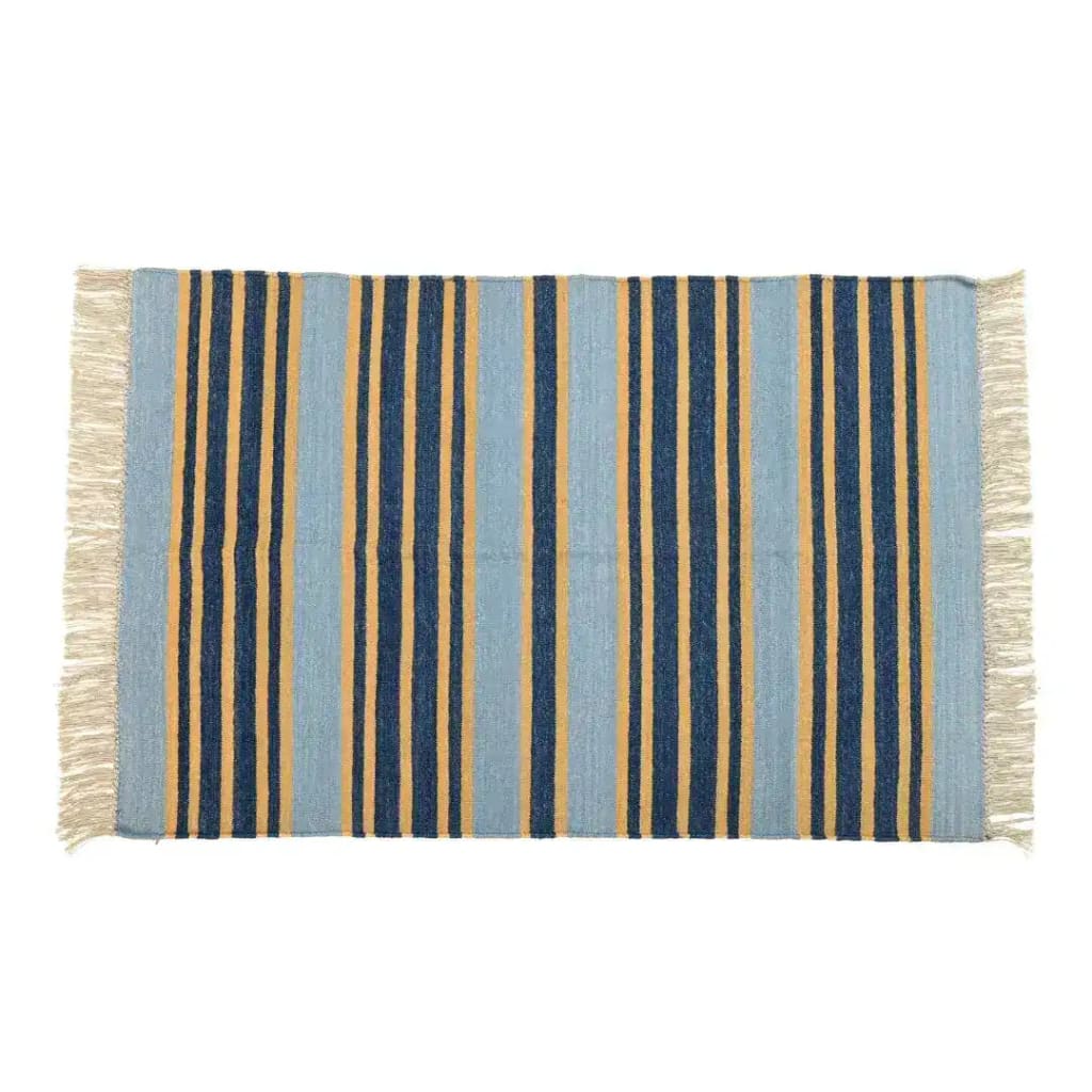 Handwoven Pastel Turmeric Stripe Cotton Rug with Fringes. This large area rug, perfect for a living room, features a boho design with alternating blue and turmeric stripes. Ideal for those seeking cotton rugs that add a touch of style to large living rooms.