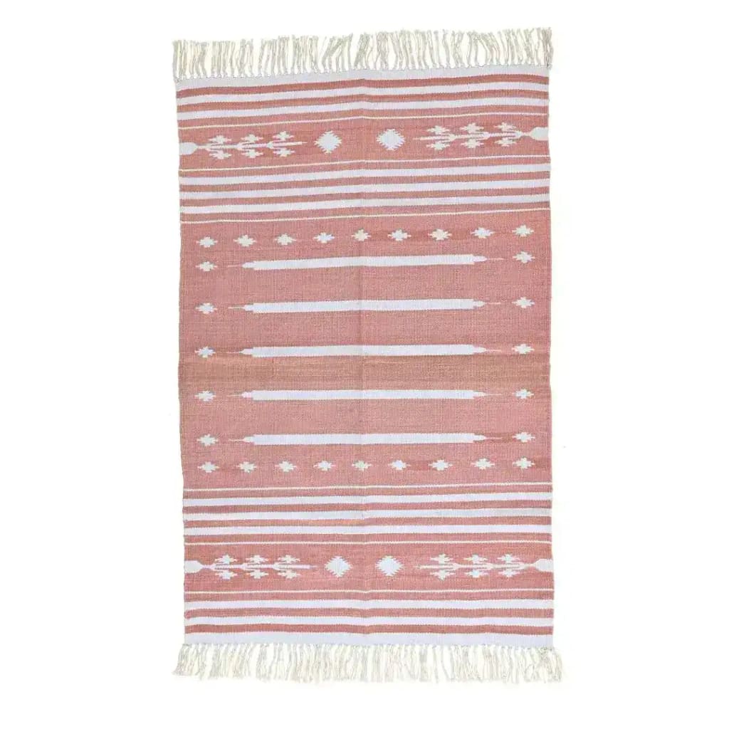 A handwoven peach and white patterned cotton area rug with fringes, perfect for a boho-inspired dining room or a large living room. The rug features intricate geometric designs and is ideal for adding a cozy touch to your living space.