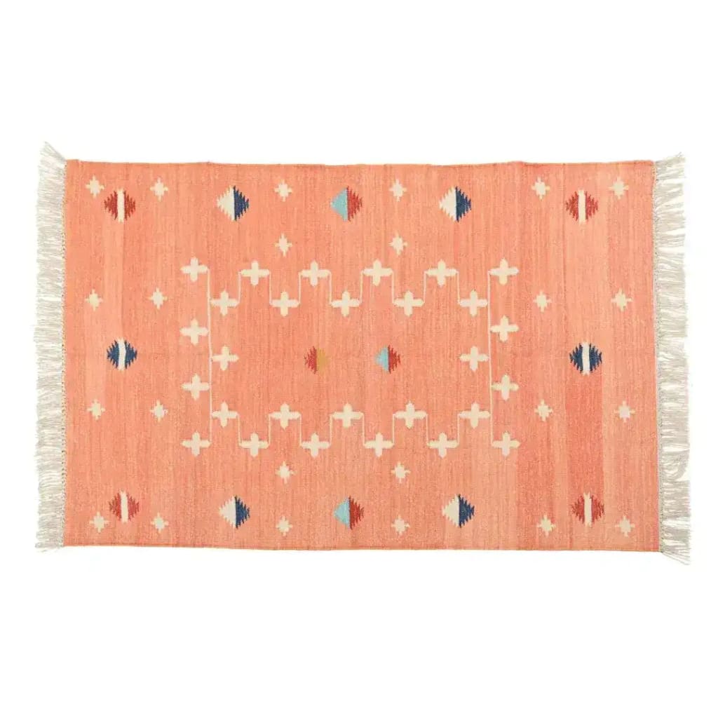 Handwoven peachy patterned cotton area rug featuring fringes and a boho design, perfect for enhancing dining room aesthetics. This dining room area rug adds a stylish touch with its unique geometric patterns, ideal for those seeking cotton rugs or dining room carpets.