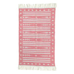 Handwoven pink and white traditional cotton area rug with fringes, ideal for dining room settings. This boho rug features intricate patterns and is perfect as a dining room carpet, adding a touch of elegance to any space.