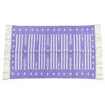 Handwoven purple and white striped cotton rug with fringes, featuring a boho design. This large area rug is perfect for adding a chic touch to your living room decor.