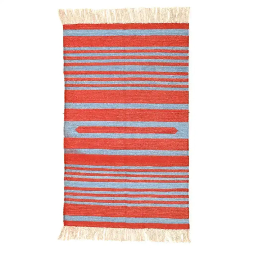 Handwoven red and blue stripe cotton area rug with fringes, ideal for adding a boho touch to your office or living room. This large living room rug features vibrant stripes and soft fringed edges, perfect for creating a cozy atmosphere.