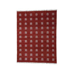 Top view of a vibrant handwoven red and white butterfly-inspired cotton area rug featuring intricate patterns, ideal for enhancing boho decor in large living rooms. This eye-catching piece serves as a perfect cotton rug centerpiece for those seeking large area rugs with a unique, artistic touch.