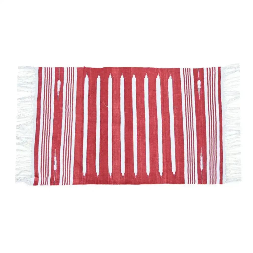 A beautifully handwoven red and white striped cotton area rug featuring elegant fringes on the edges. This minimalistic boho rug is perfect for adding a touch of charm to your bedroom or formal dining room. The rug's classic design makes it a versatile choice for dining room area rugs, enhancing the warmth and comfort of any space.
