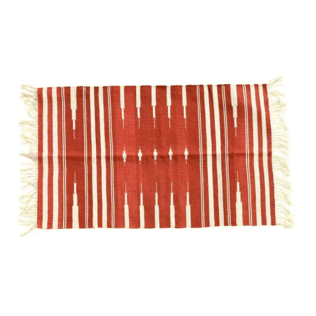 A beautifully handwoven red and white stripe patterned cotton rug with fringes, perfect for adding a boho touch to your living room. This large area rug is ideal for creating a cozy and stylish atmosphere in any space.