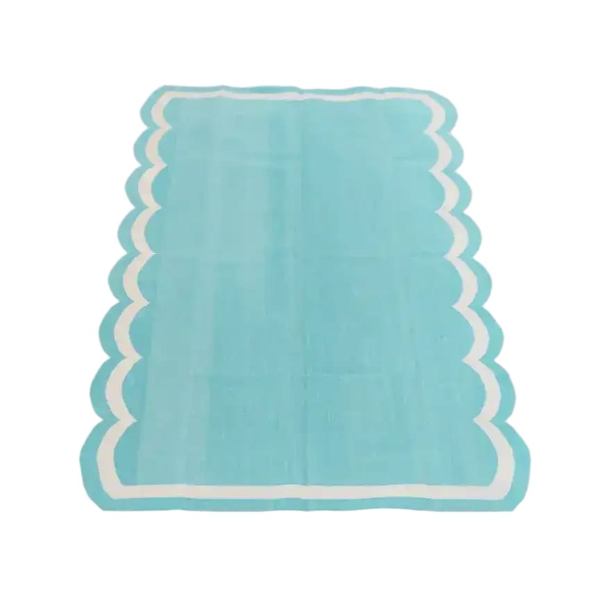 Handwoven reversible cotton scalloped area rug in blue, perfect for adding a touch of boho style to your bedroom or living room. This 8x10 rug features a unique scalloped design, making it an ideal choice for living room area rugs.