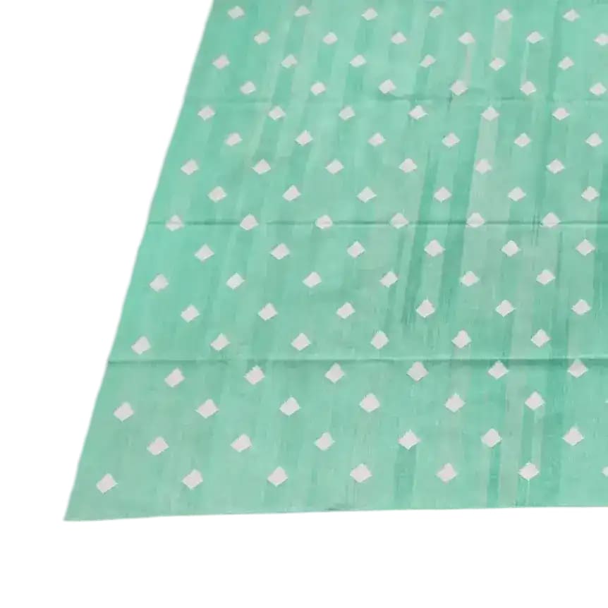 Top view of a handwoven reversible diamond cotton rug in light green, perfect as a large area rug for a boho-style living room. The rug features a subtle diamond pattern, ideal for enhancing the aesthetic of your living space with a touch of elegance.