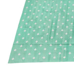 Top view of a handwoven reversible diamond cotton rug in light green, perfect as a large area rug for a boho-style living room. The rug features a subtle diamond pattern, ideal for enhancing the aesthetic of your living space with a touch of elegance.