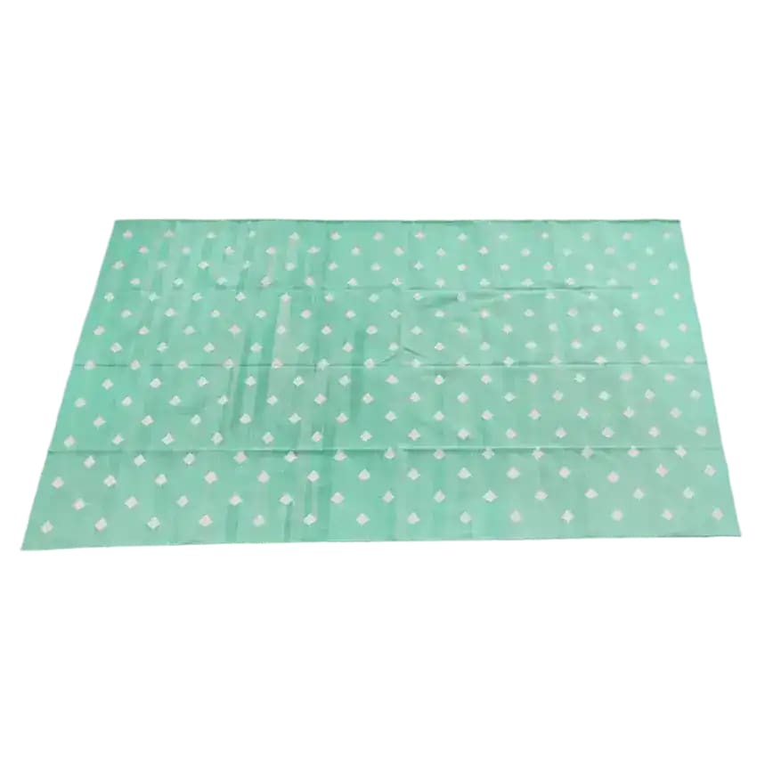 Handwoven reversible diamond cotton rug in light green, perfect for adding a boho touch to your living room. This large area rug features a subtle diamond pattern, ideal for those seeking stylish and comfortable cotton rugs.