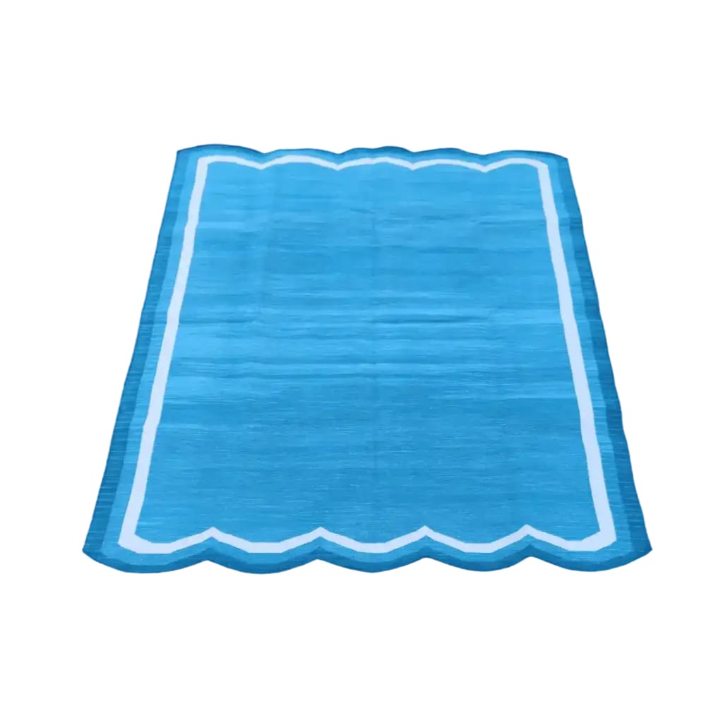 This beautiful Handwoven Scalloped Cotton Rug in blue and white is a perfect addition to any bedroom. The vintage rug features a unique scalloped design, adding a touch of boho charm to your space. Crafted from high-quality cotton, this large area rug is both durable and stylish, making it an ideal choice for bedroom area rugs. Enhance your home decor with this elegant cotton rug, perfect for creating a cozy and inviting atmosphere.