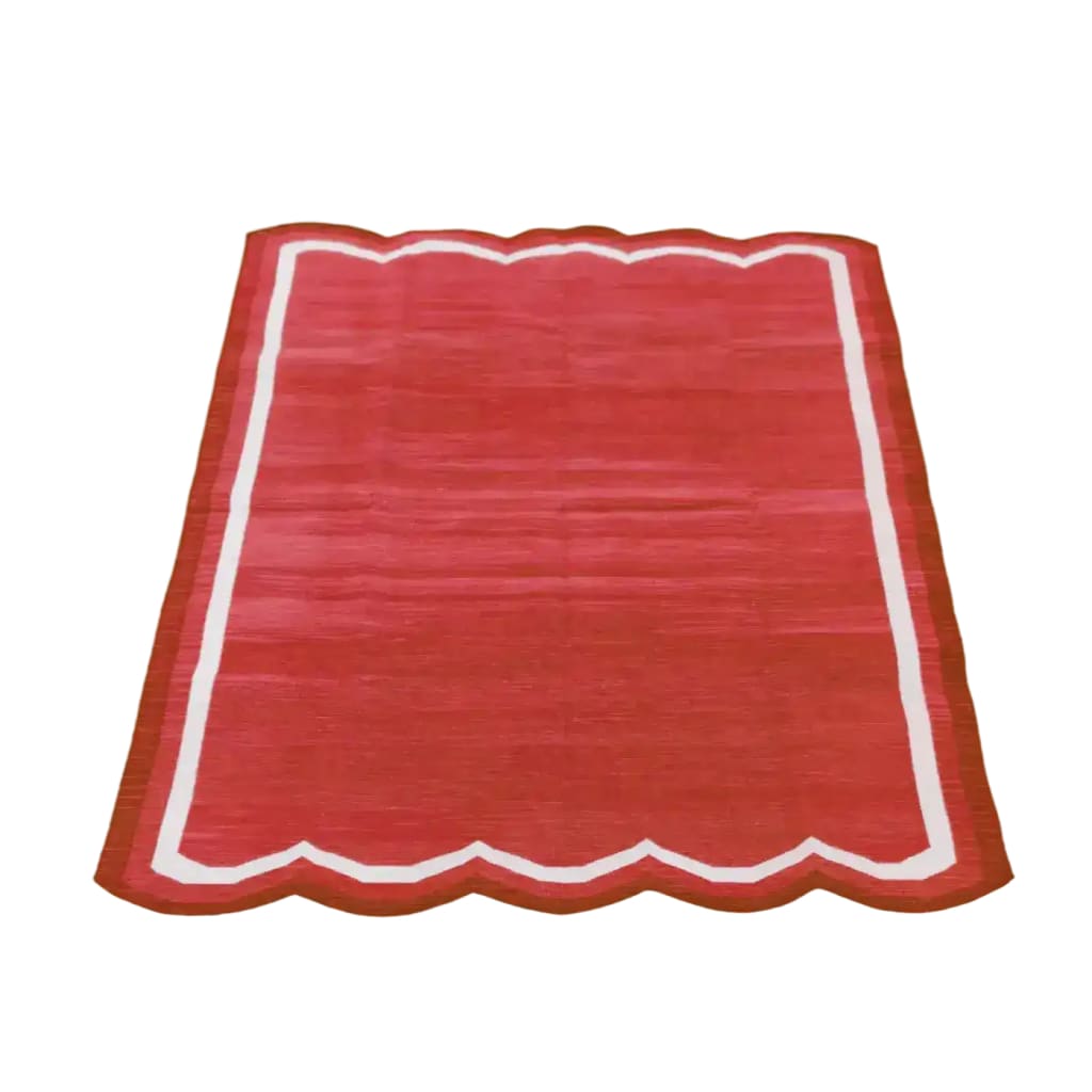 Handwoven scalloped cotton area rug in vibrant red, ideal for a vintage or boho-inspired dining room or office. This elegant cotton rug features a unique scalloped edge, making it a perfect addition to formal dining room settings or as a striking dining room carpet.