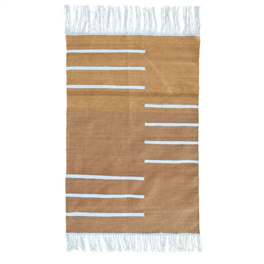 Handwoven turmeric and white minimalistic cotton area rug with fringes, showcasing a boho design. Perfect for large area rugs in a living room, this rug features a simple pattern with horizontal white stripes on a turmeric background, adding a touch of elegance and warmth.