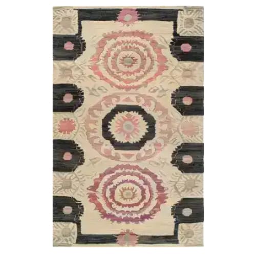 Harmony Circles Hand Tufted Rug showcasing a stunning vintage design, perfect as an area rug for a dining room. This wool rug features intricate circular patterns in warm tones ideal for placing under a dining table or in an office space.