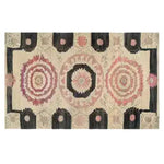 Harmony Circles Hand Tufted Area Rug featuring a vintage design with intricate circular patterns in soft pink and beige tones, ideal for a dining room or office. This wool rug adds a classic touch to any dining table setting.