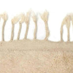 Close-up view of the fringe detail on the Harry and Henry Moroccan Handwoven Wool Runner Rug, perfect as a contemporary kitchen or hallway runner rug. The natural wool texture adds a cozy touch, making it ideal for kitchen runner rugs and bathroom runner rugs.