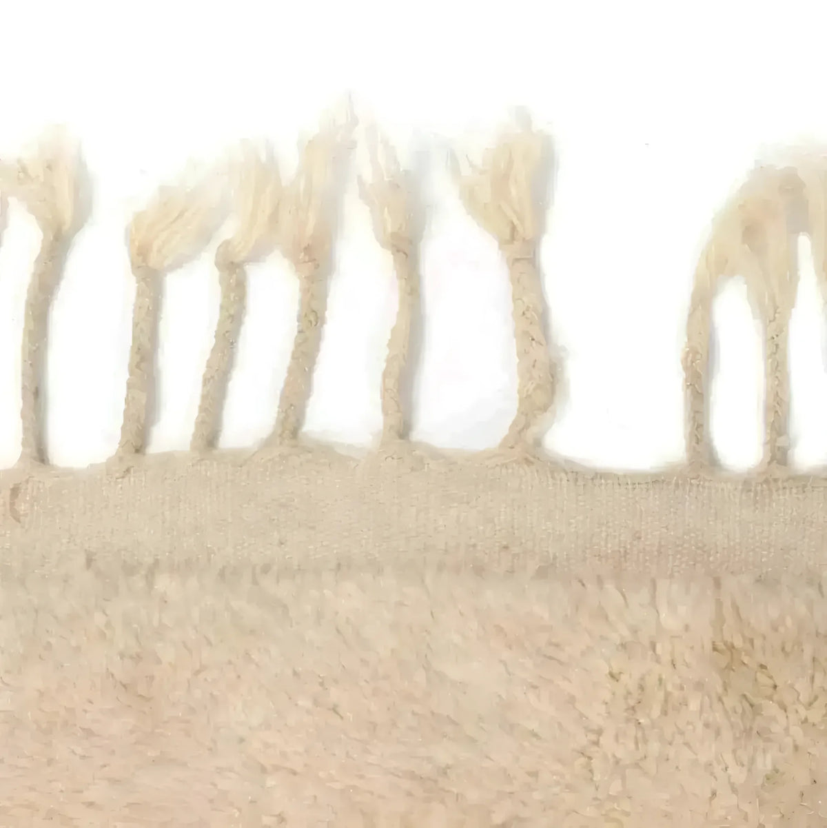 Close-up view of the fringe detail on the Harry and Henry Moroccan Handwoven Wool Runner Rug, perfect as a contemporary kitchen or hallway runner rug. The natural wool texture adds a cozy touch, making it ideal for kitchen runner rugs and bathroom runner rugs.