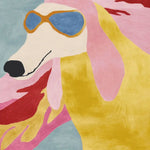 A vibrant and contemporary wool area rug featuring a playful, abstract design of a dog wearing sunglasses. This hand-tufted living room area rug combines bold colors like pink, yellow, and blue, making it a stylish addition to modern home decor.