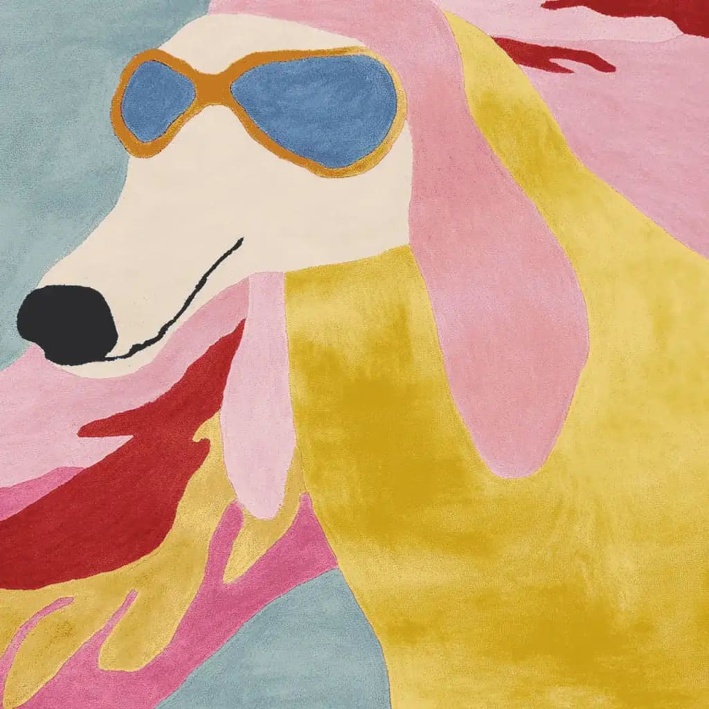 A vibrant and contemporary wool area rug featuring a playful, abstract design of a dog wearing sunglasses. This hand-tufted living room area rug combines bold colors like pink, yellow, and blue, making it a stylish addition to modern home decor.