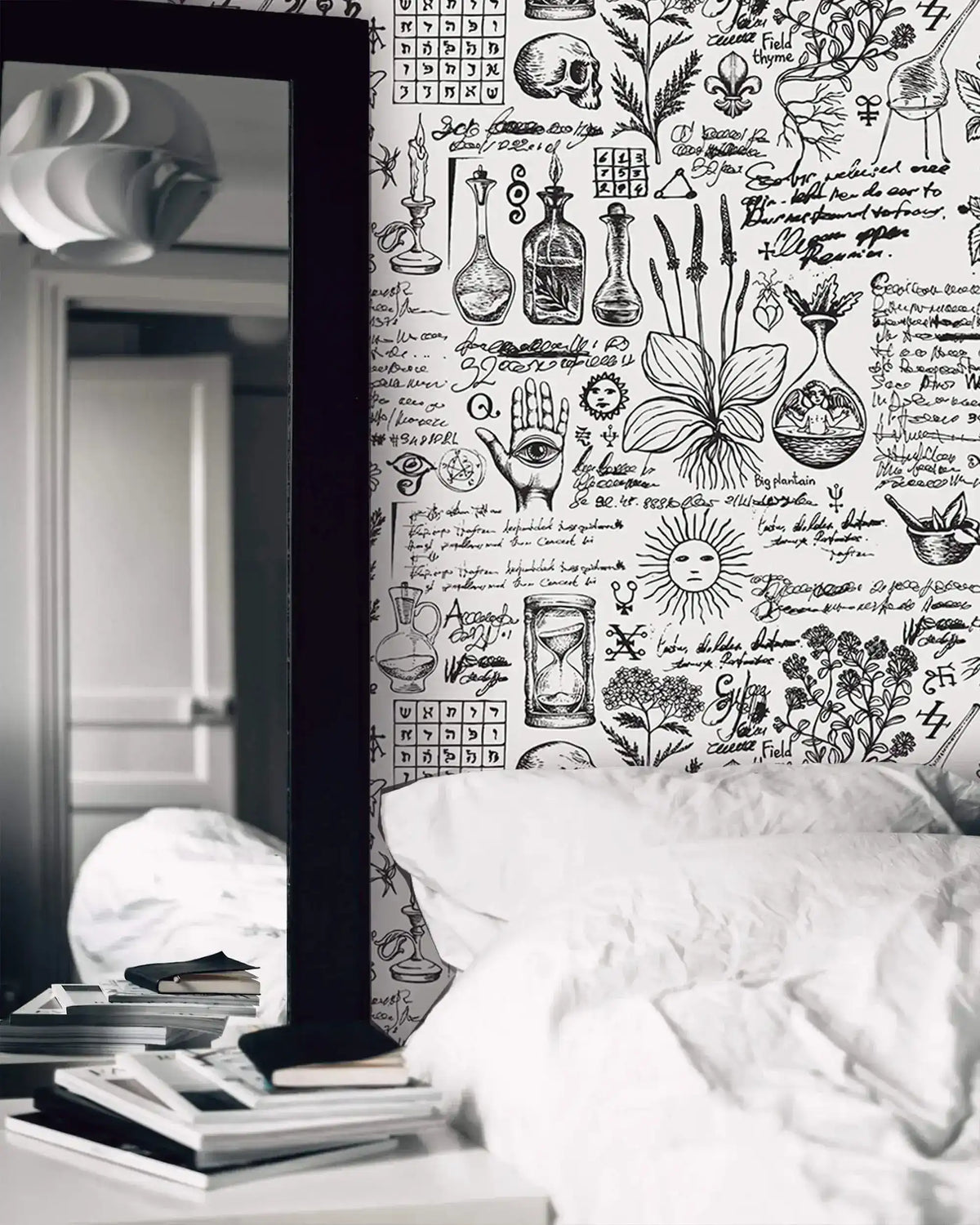 Herbal alchemy wallpaper with inky botanical sketches and script beside a bed and tall mirror