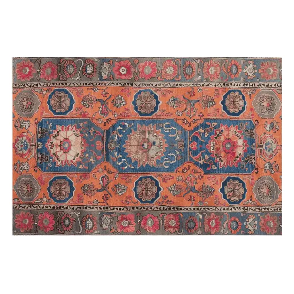 Discover the Heritage Bloom Hand Knotted Area Rug, a stunning vintage rug perfect for large living rooms. Featuring intricate Persian patterns in vibrant blue and orange hues, this area rug adds elegance and charm to any space.