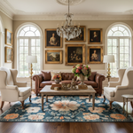 Luxurious living room with classical decor, including a chandelier, paintings, and floral arrangements.