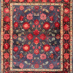 This Heritage Chic Hand Knotted Area Rug showcases a vibrant floral design, reminiscent of vintage Persian rugs. The rich blue background sets off the intricate red and pink flowers, creating a stunning centerpiece perfect for any living room.
