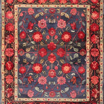 This Heritage Chic Hand Knotted Area Rug showcases a vibrant floral design, reminiscent of vintage Persian rugs. The rich blue background sets off the intricate red and pink flowers, creating a stunning centerpiece perfect for any living room.