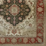 This Heritage Floral Elegance Hand Knotted Area Rug showcases a vintage Persian-inspired design with intricate floral patterns in rich, earthy colors. Perfect for adding a touch of elegance to your living room, this floral rug blends beautifully with traditional and contemporary decor styles.