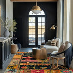 A stylish living room featuring a Heritage Swedish Wool Hand Knotted Area Rug. This large area rug, with its vibrant geometric and abstract patterns, adds warmth and elegance to the space. The square rug complements the contemporary furniture, creating a cozy and inviting atmosphere ideal for a large living room.