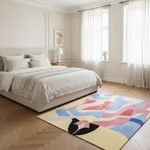 Modern bedroom with a colorful abstract rug on a wooden floor.