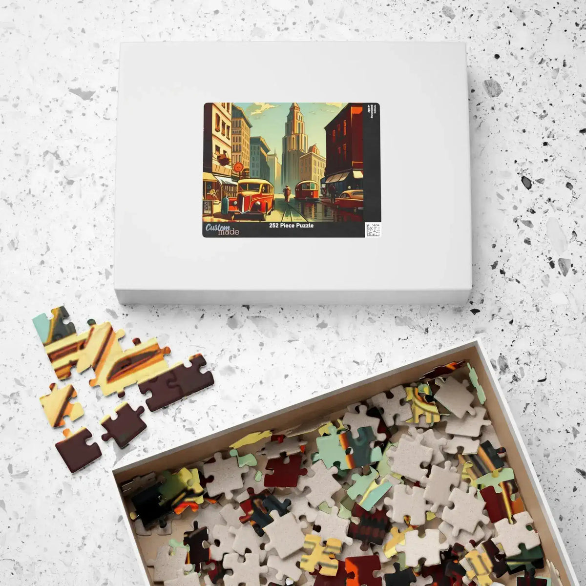 Historical City puzzle box labeled 252 pieces beside an open tray of jumbled pieces