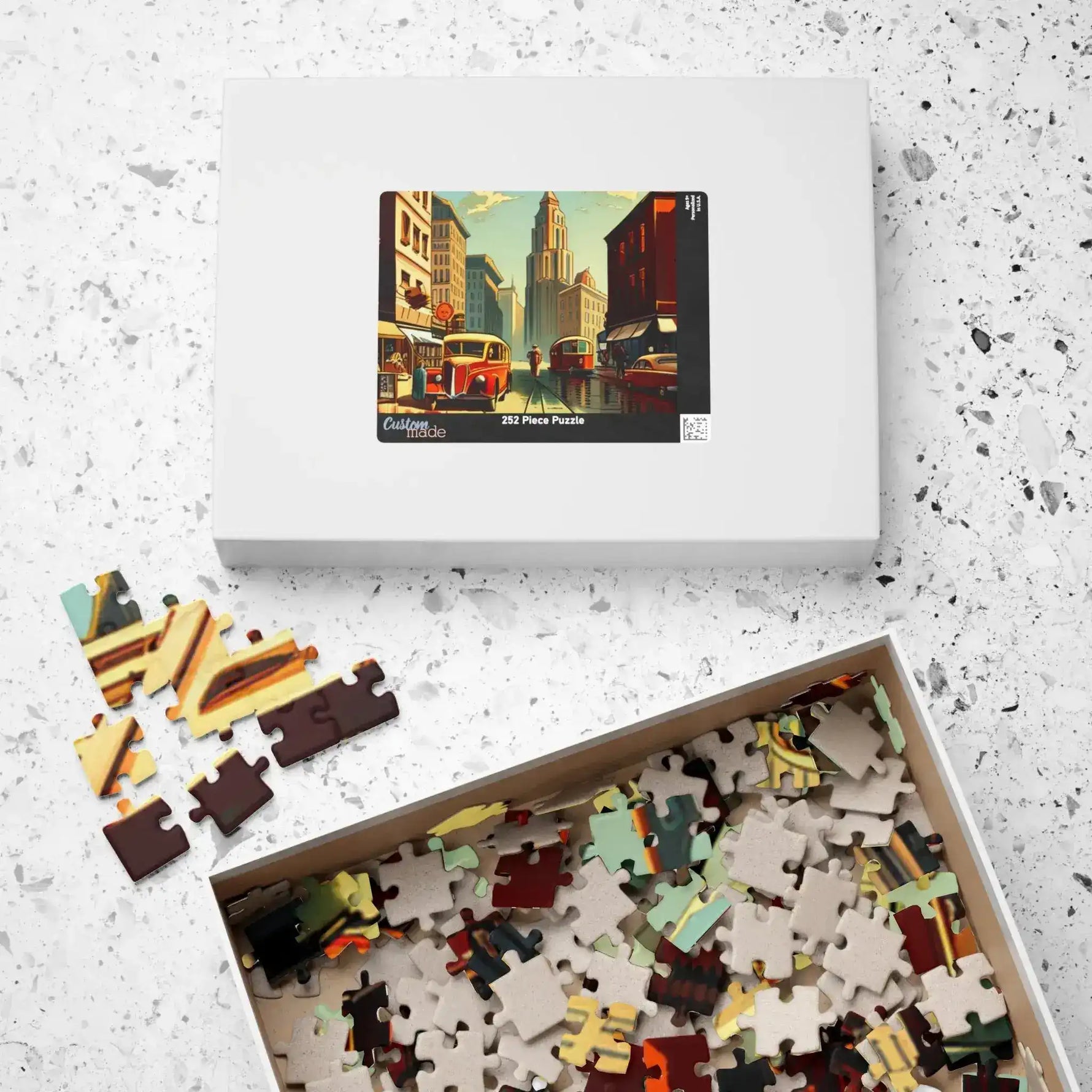 Historical City puzzle box labeled 252 pieces beside an open tray of jumbled pieces