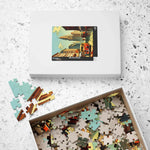 Historical City puzzle box with cityscape lid lying flat beside its open tray of pieces