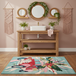 Bathroom with wooden vanity, round mirror, and a decorative rug on a pink wall.