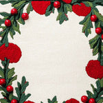 Close-up view of the Holly Berry Bliss Hand Tufted Area Rug featuring vibrant red berries and lush green leaves on a soft wool texture. Ideal for adding a festive touch to your office or dining room, this wool rug brings warmth and style to any space.