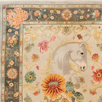 This exquisite hand-knotted area rug features a detailed horse motif surrounded by vibrant floral patterns, ideal for adding elegance to your living room. The Persian-inspired design, with its intricate border and rich colors, makes it a perfect choice for living room rugs 8x10, offering both style and comfort.
