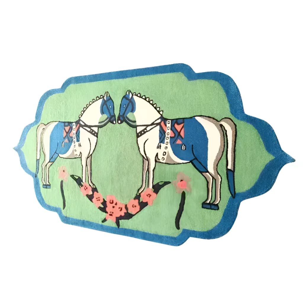 Beautiful hand-tufted area rug featuring a boho design with two stylized horses in blue and white on a green background, perfect for adding a unique touch to your dining room or living room. This large wool rug brings an artistic flair to any space, making it an ideal choice for those seeking large area rugs for living room and dining room settings.