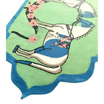 A vibrant hand-tufted rug with a whimsical horse design, featuring a play of green, blue, and floral accents. Perfect for adding a boho touch to large area rugs in dining rooms or living rooms, crafted from high-quality wool.