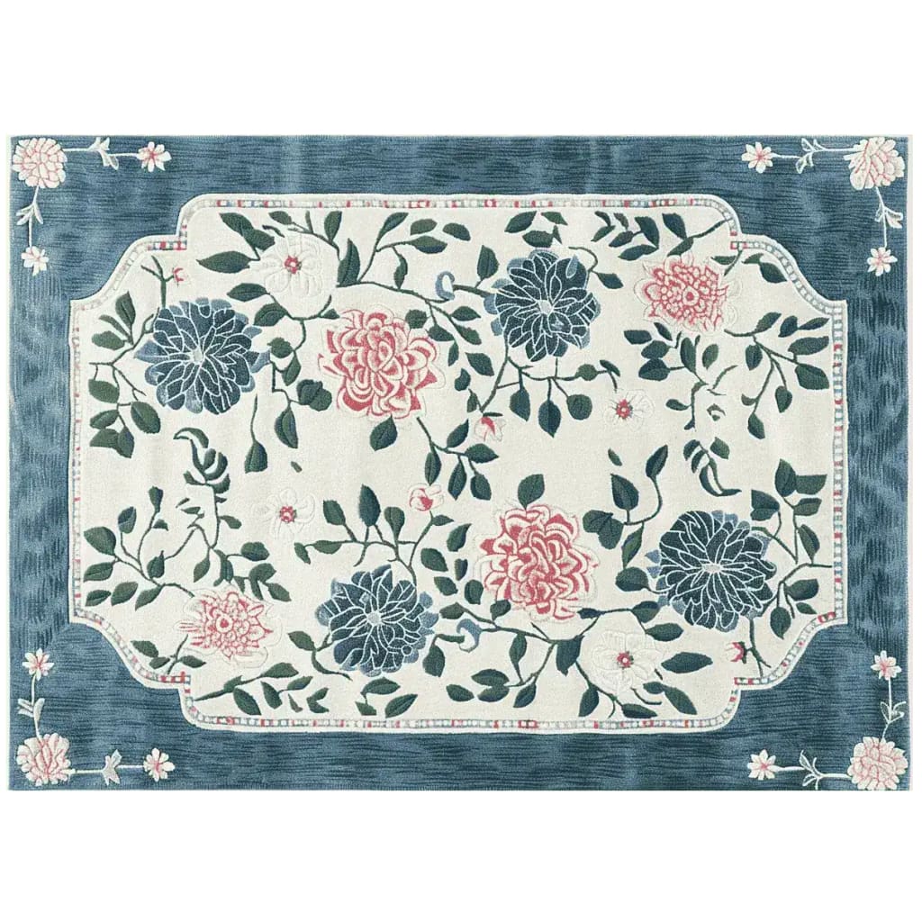 A beautifully designed area rug featuring an intricate floral pattern with vibrant pink and blue flowers against a cream background. This wool rug adds elegance to large living room spaces, perfect for enhancing the decor with its lush, hand-tufted texture.