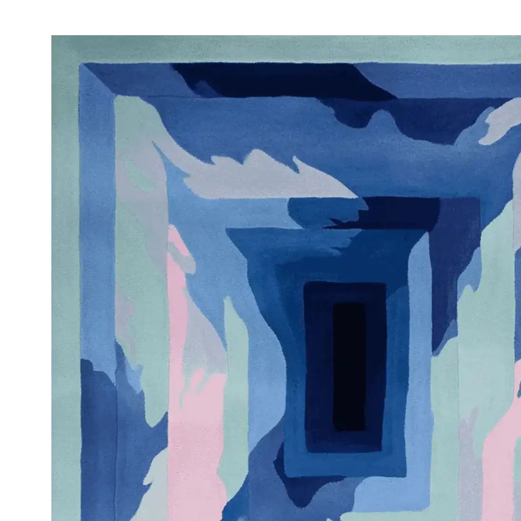 A striking contemporary area rug featuring a hand-tufted wool design with abstract patterns in shades of blue, pink, and white. This rug adds a modern touch to any living room space, blending art with functionality.