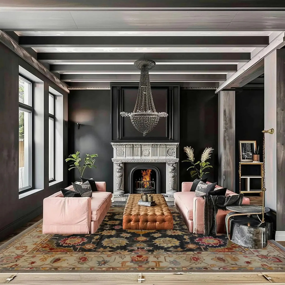Living room with pink sofas, a fireplace, and decorative black floral handmade rug.