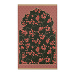 Imperial arch bloom rug, coral blossoms on dark green with pink quatrefoil border, full overhead view